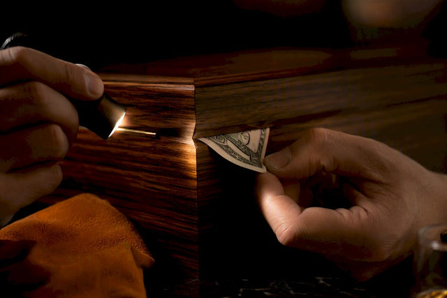 Collector checking a humidor lid seam