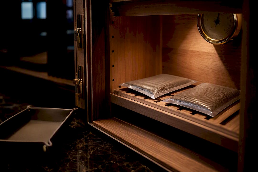 Two-way humidity packs inside a cedar humidor
