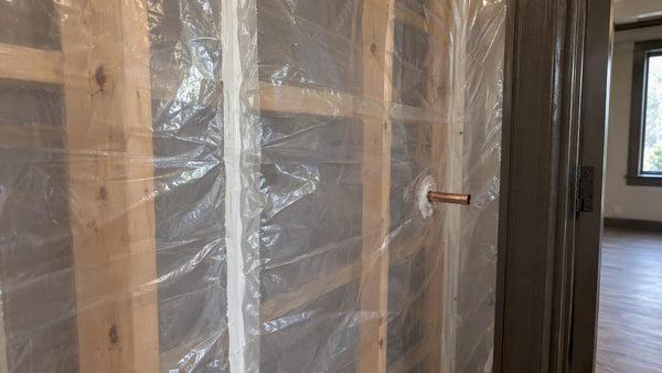 Vapor barrier sealed around humidor wall penetration